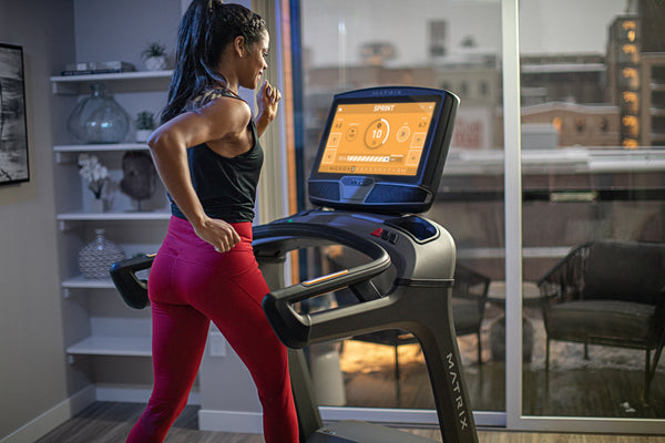 Woman Running on Matrix Treadmill